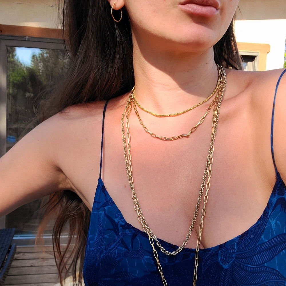Layered gold necklaces